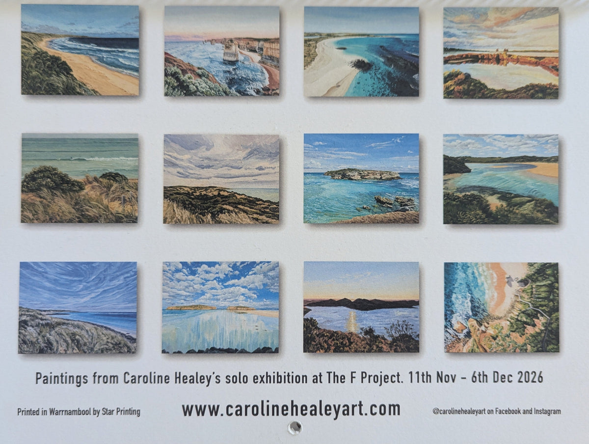 A spiral-bound printed catalog or art exhibition booklet lying on a wooden surface, showing a grid of twelve small coastal landscape paintings on the cover. Text at the bottom reads about Caroline Healey's solo exhibition at The F Project.